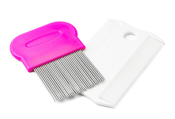 Colorful plastic and metal combs on a white background