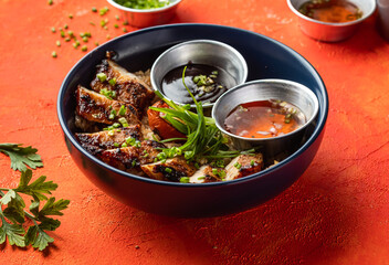 Hickory Bbq Pork Belly Rice Bowl with Sauce, Coriander, and Green Onion isolated orange background side view of fast food