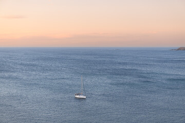 Fototapeta premium Yacht moored in the calm ocean