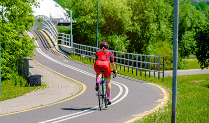 Fototapeta premium Cyclist ride on the bike path in the city Park 