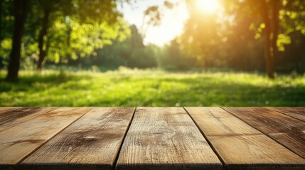 Fototapeta premium Wooden table product display concept set against a blurred green meadow with trees featuring a bokeh background that evokes a summer ambiance
