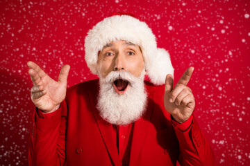 Photo of funky grey hair aged man dance wear santa cap red suit isolated on red color background