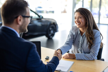 Car, dealership or documents with salesman and customer in showroom for conversation, deal or...