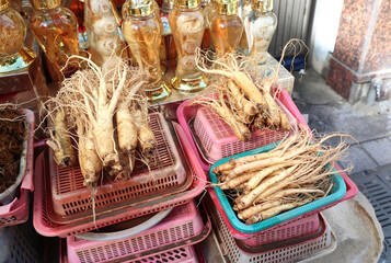 Fresh ginseng in Korean street market. Ginseng root sale at a market in South Korea. Street trade of traditional asian medicine