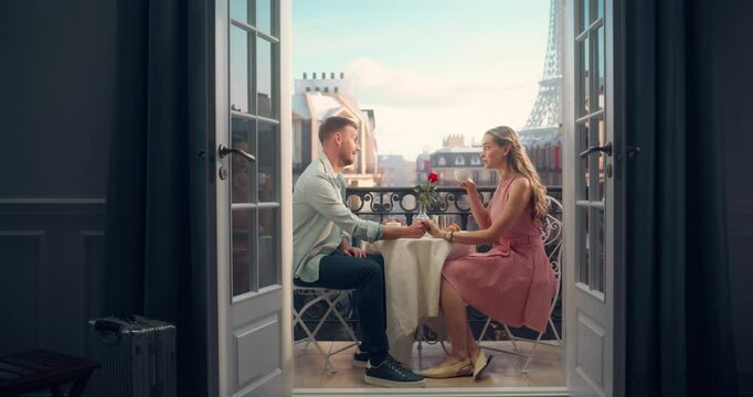 Young Man and Woman Enjoying a Quiet Breakfast on a Balcony Overlooking the Eiffel Tower, Sharing Croissants and Coffee. Their Morning is Filled with Romance and the Magic of Paris