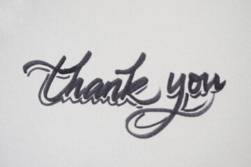 Hand written thank you note on a white paper