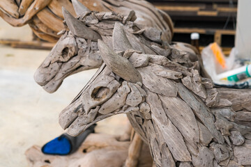 Samut Prakan, Thailand -May, 13, 2024 :Sculptural Elegance: Wooden Animal Ensemble at Samut Prakan, Thailand.