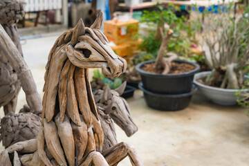 Samut Prakan, Thailand -May, 13, 2024 :Sculptural Elegance: Wooden Animal Ensemble at Samut Prakan, Thailand.