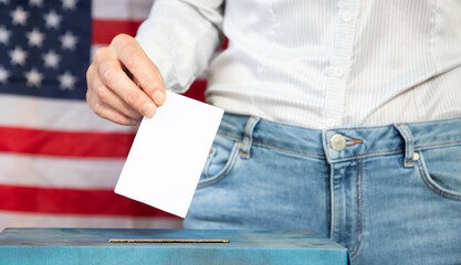usa elections the hand of voter putting her vote in the ballot box