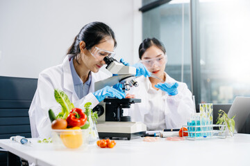 Food scientists in lab coats, testing samples, and analyzing food safety and quality