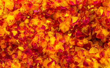 Multi-colored crystal mineral stone. Gems. Mineral crystals in the natural environment. Texture of precious and semiprecious stones. shiny surface of precious stone