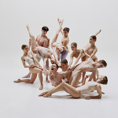 Group of ballet dancers performing in minimalistic costumes, emphasizing elegance and coordination....