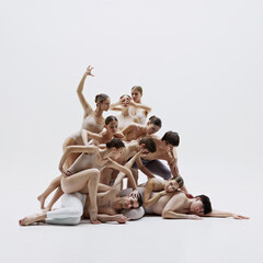 Group of ballet dancers performing intricate choreography, blending grace and psychology in movements. Stunning example of ballet as form of visual art. Concept of art, classical dance, performance
