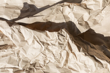 Crumpled brown paper texture symbolizing recycling and sustainability, perfect for Earth Day or...