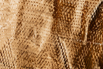 Close-up texture of brown honeycomb cardboard represents eco-friendly packaging solutions and...