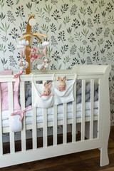 baby girl room detail with bunnies and white bed