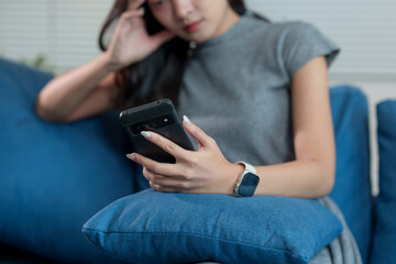 A woman is sitting on the floor in the living room. She is depressed, stressed, worried and in distress for life. Problems from work concept of living, state of mind.