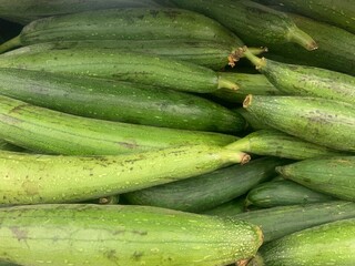 Sponge gourd or gilki in vegetable market. Indian market.