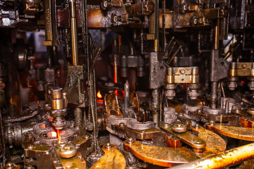 Glass factory, production of glass containers. Molten glass is blown into molds. Robotics in industry. Modern technologies, robotic machines produce products. Technological work at the plant.