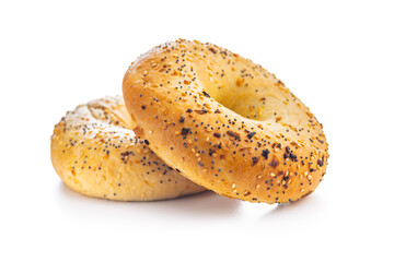 Bagel sprinkled with fried onion, sesame and poppy seeds isolated on white background.