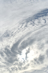 Twirl clouds at sun in dramatic sky, Nature background