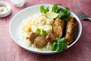Homemade sausages with couscous
