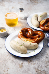 White sausages with salted pretzel