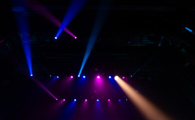 Colorful concert lights on empty stage