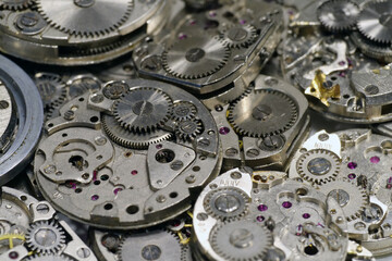 Old mechanical watches with gears and cogs. Watch or clock mechanisms