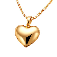 Shiny gold heart-shaped pendant on a chain, isolated on a transparent background