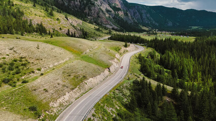 Fototapeta premium the car is driving along a mountain road in Altai