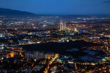 City illuminated at dusk, seen from above. The European capital of North Macedonia, Skopje.