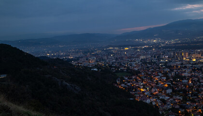 City illuminated at dusk, seen from above. The European capital of North Macedonia, Skopje.