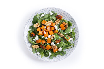 Pumpkin salad with arugula, walnuts and feta cheese isolated on white background