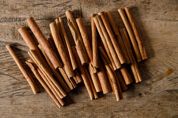 cinnamon sticks on wooden background