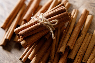cinnamon sticks on wooden background