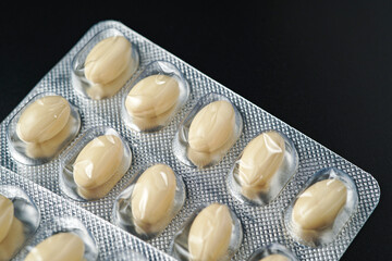 Oil filled blister pack white softgel capsules of food supplements, fish oil, omega 3, vitamin DHA