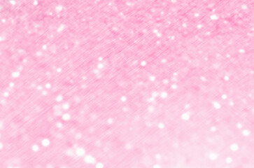 Pink glittering christmas lights. Blurred abstract background