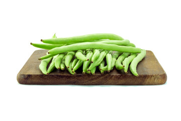 Group of french bean, haricot bean, snap bean, string beano on wooden cutting board isolated on white background closed up stack with clipping path