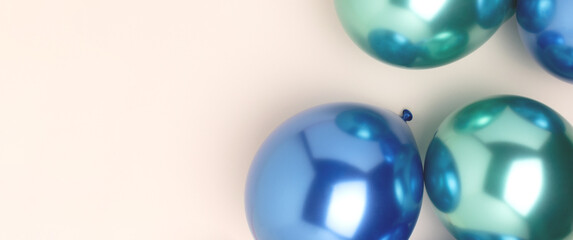 Banner with foil balloons scattered on a beige background. Festive concept with copy space.