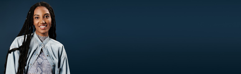 A confident young woman showcases her fashionable attire, smiling warmly in an elegant setting.