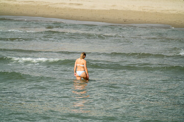 Lonely woman walking in the mediterranean sea © Andrzej