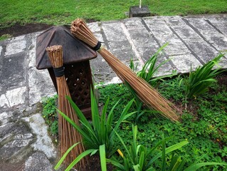 broom stick with garden lantern on the garden 