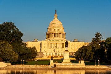 Fototapeta premium Front view of United States Capitol under a blue sky at sunset