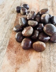 Chestnuts on the table ready to roast.
