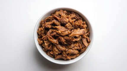 Obraz premium Shredded dried pork served in a bowl against a clean white backdrop