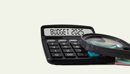 The BUDGET for 2025 is the words on the calculator display on a white background. Business concept