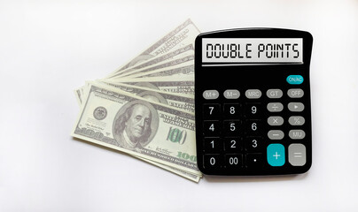 The text on the calculator display with double points on a white background with dollars