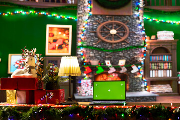 Empty cabin decorated with garlands and baubles next to isolated mockup, awaits Santa Claus at the North Pole. The festive cozy workshop having wrapped gifts ready for a magical Christmas night.