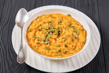 butternut squash puree with pumpkin seeds in bowl